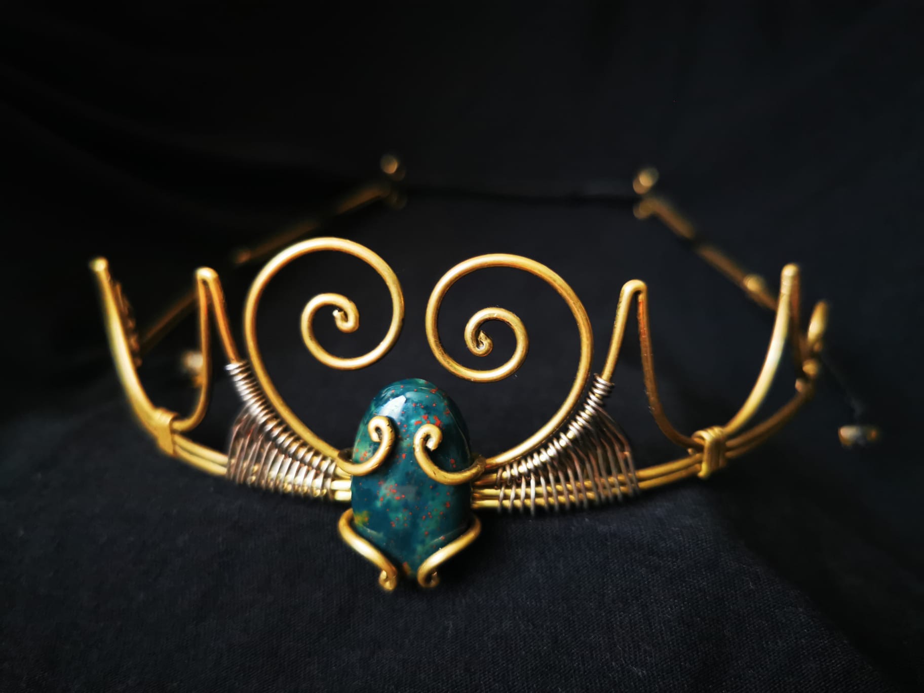 Handcrafted brass crown with teal crystal — made by artisan lineage family, Mexico